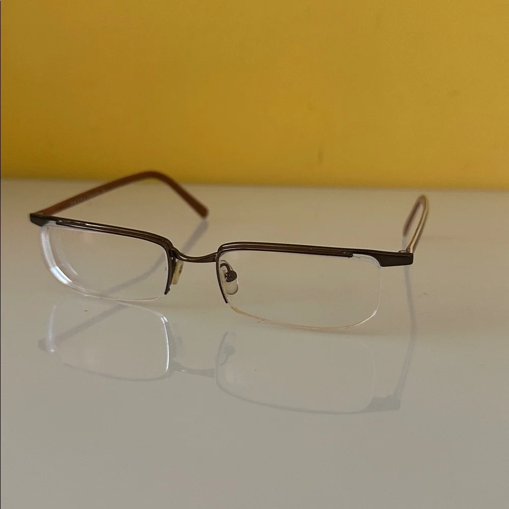 Prada Sleek Bronze Titanium Frameless Rectangular Prescription Glasses Frame